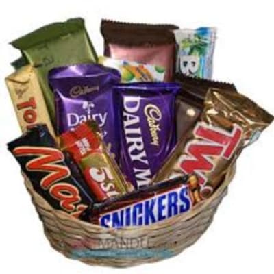 Basket of assorted chocolate bars and candy wrappers