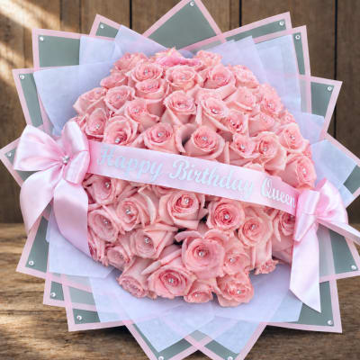Pink rose bouquet with a birthday ribbon and satin bow