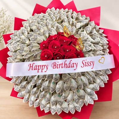 Bouquet of red roses and folded dollar bills with a birthday ribbon