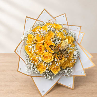 Yellow rose bouquet with white baby's breath and clear-edged wrapping