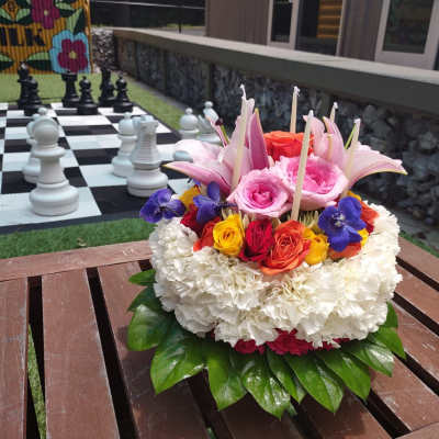 Colorful floral arrangement with roses and lilies on a table