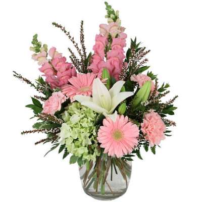 Pink and white mixed bouquet in a clear glass vase