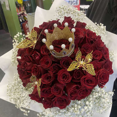 Bouquet of red roses with white baby's breath and gold butterfly accents
