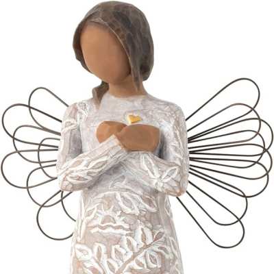 Angel figurine in a white patterned dress with wire wings