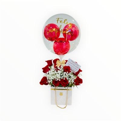 Red rose arrangement with white filler flowers in a gift box, topped with a clear birthday balloon