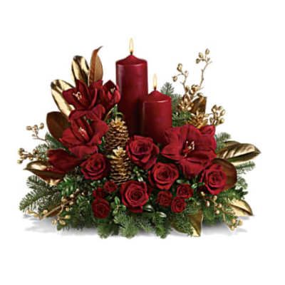 Red rose and amaryllis centerpiece with two red candles, gold pinecones, and gold leaves.