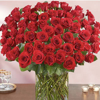 Large bouquet of red roses in a clear glass vase