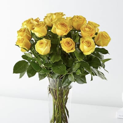 Bouquet of yellow roses in a clear glass vase