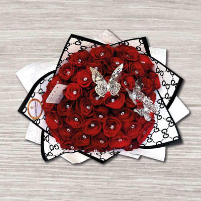 Round bouquet of red roses with butterfly decorations