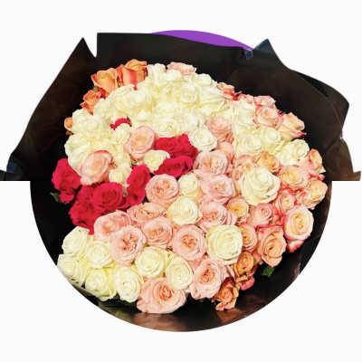 Large bouquet of cream, blush, and hot pink roses wrapped in black paper