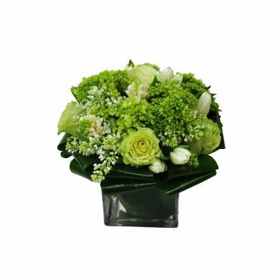 Green and white bouquet in a square glass vase