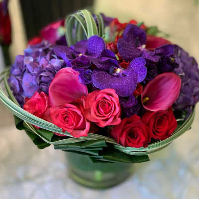 Bouquet of pink and purple flowers in a glass vase