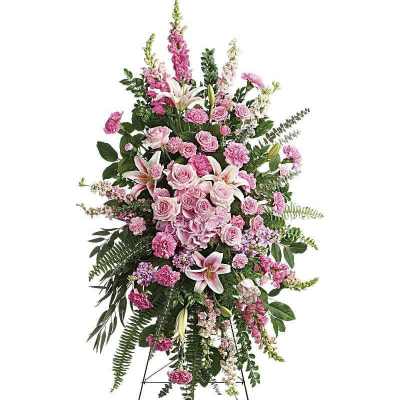 Tall pink floral standing spray on an easel