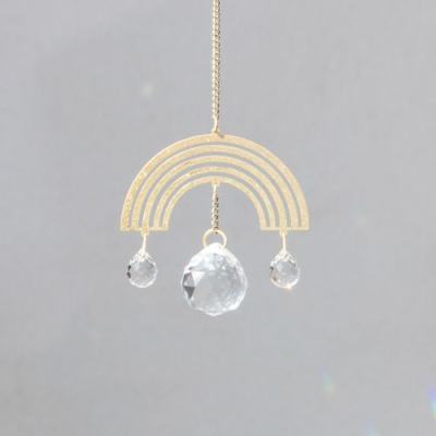 Gold rainbow hanging ornament with three clear crystal drops