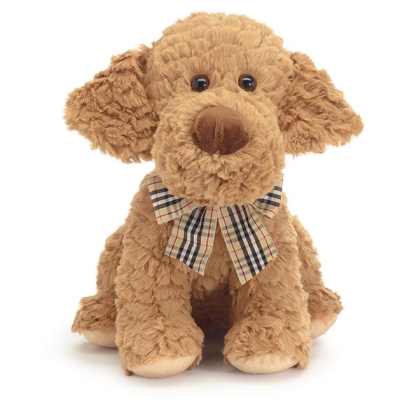 Tan plush dog with floppy ears and a plaid bow sitting upright on a white background