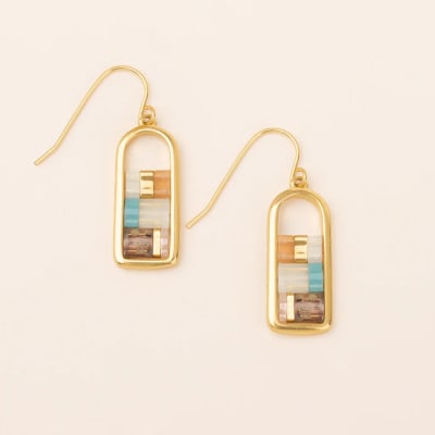Pair of gold drop earrings with multicolored rectangular inlay on a light background