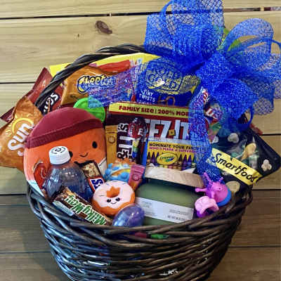 Gift basket filled with candy, a drink, and a blue ribbon bow