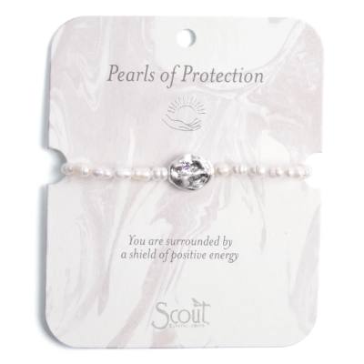 Pearl beaded bracelet with a central silver-toned bead on a card labeled Pearls of Protection