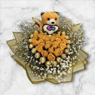 Orange rose bouquet with a teddy bear and gold-wrapped chocolates