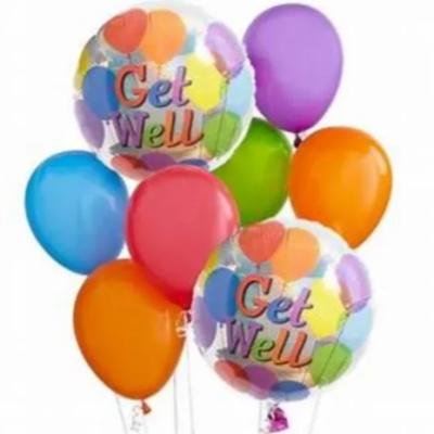 Colorful balloons with two clear balloons reading "Get Well"