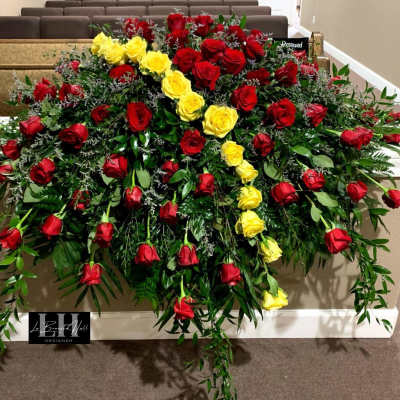 Large casket spray of red and yellow roses