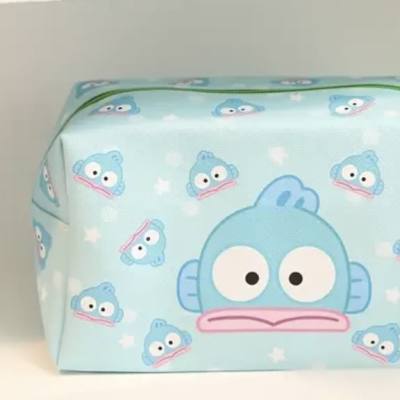 Light blue zippered pouch with cartoon fish faces and a green handle