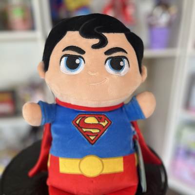 Superman plush toy with a red cape and blue suit