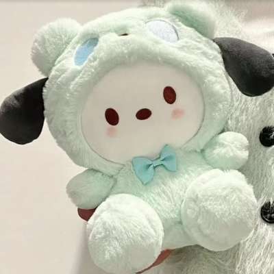 Mint plush sheep toy with a blue bow