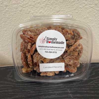 Container of candied pecans with a label