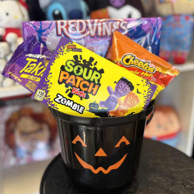 Halloween candy bucket filled with assorted snack bags