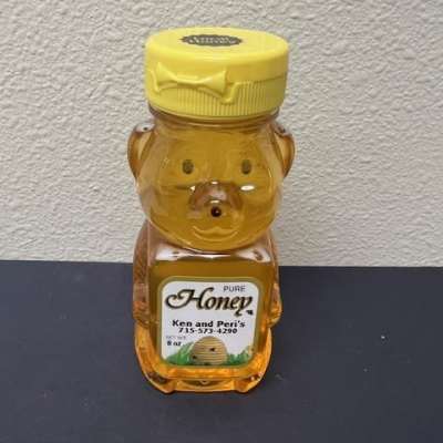 Bear-shaped honey bottle with a yellow cap
