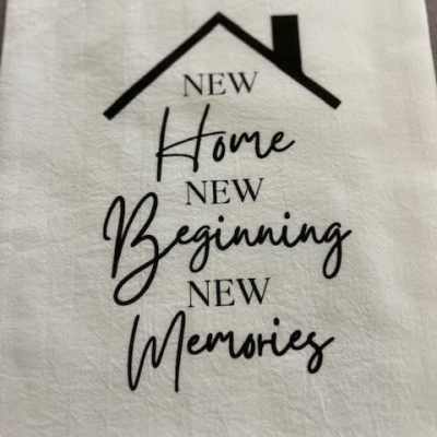 White fabric with a house graphic and the words New Home, New Beginning, New Memories