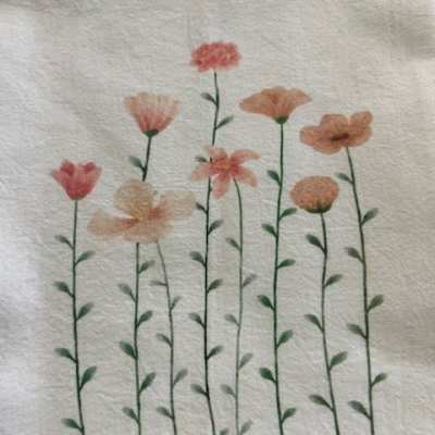 Floral print with tall pink and peach flowers on thin stems