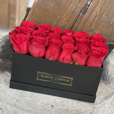 Box of red roses in a black gift box