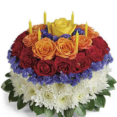 Round floral cake with roses and candles