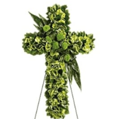 Green floral cross on a metal stand