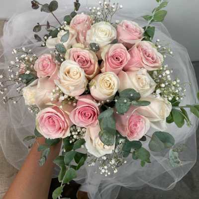 Pink and white rose bouquet with baby's breath and eucalyptus