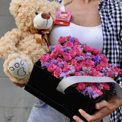 Pink rose bouquet in a black box with a teddy bear