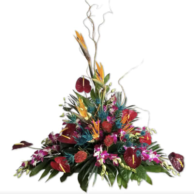 Tropical floral arrangement with red anthuriums and bird of paradise