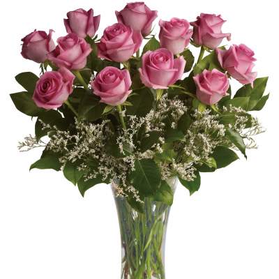 Pink roses arranged in a clear glass vase