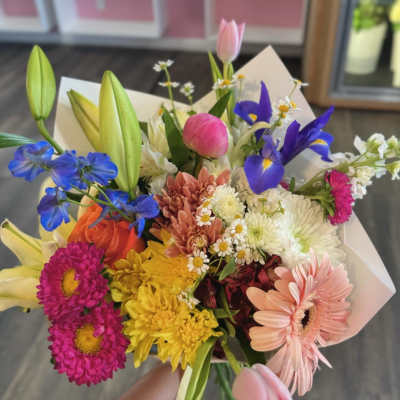 Colorful mixed bouquet with lilies, tulips, daisies, and gerbera daisies