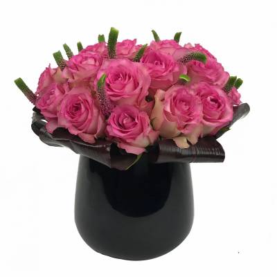 Pink rose bouquet in a black vase