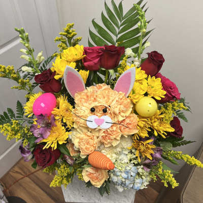 Colorful bouquet with a bunny face and Easter eggs