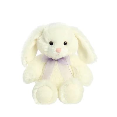 Cream-colored plush bunny with floppy ears and a light purple ribbon bow.