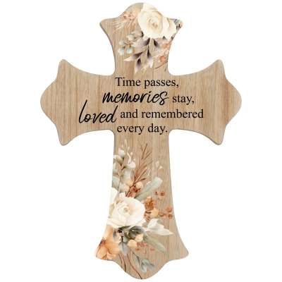 Wooden cross plaque with cream and peach floral design and a memorial quote in black script text.