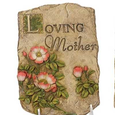 Decorative stone plaque with 'Loving Mother' text and pink floral carvings on a stand