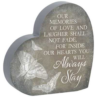 Heart-shaped memorial plaque with butterflies and sentimental inscription in white lettering