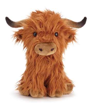 Shaggy orange plush cow with small horns sitting upright