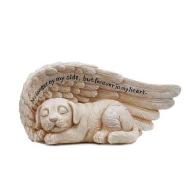 Cream-colored figurine of a sleeping puppy cradled by a single angel wing with engraved text.