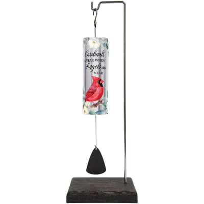 Memorial wind chime with red cardinal design on a tall metal stand with dark wood base